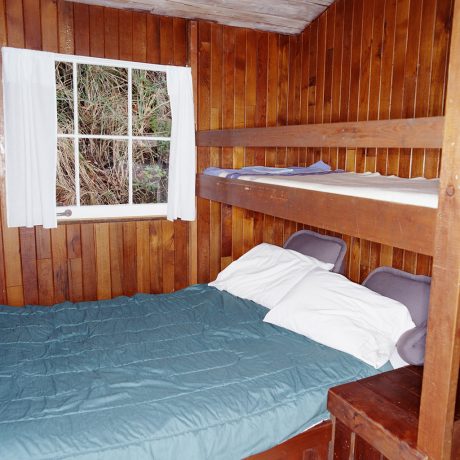 Bed in log cabin